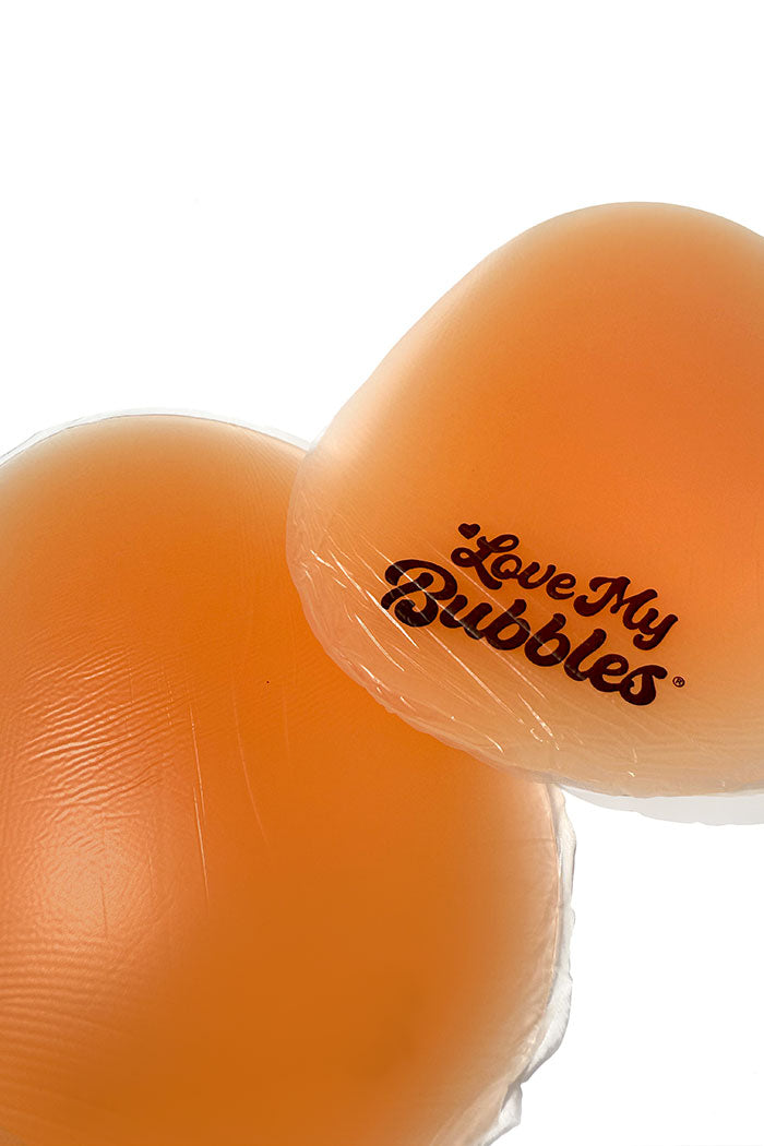 Close-up of silicone pad used for hip or butt padding on white backround