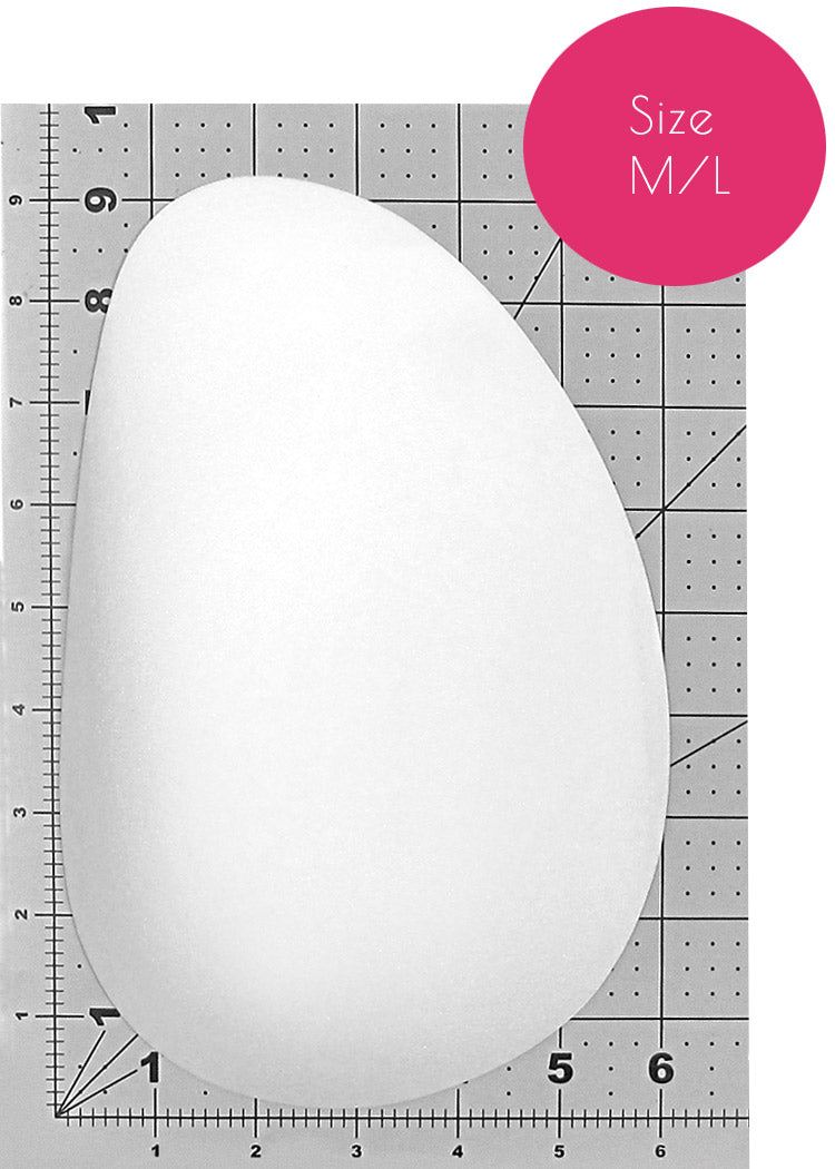 White Foam Butt Pads, also used as Hip Pads, in Oblong shape on a measurement grid.