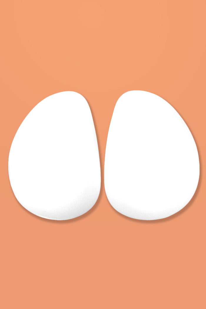 Foam pads for butt or hips on a peach background
