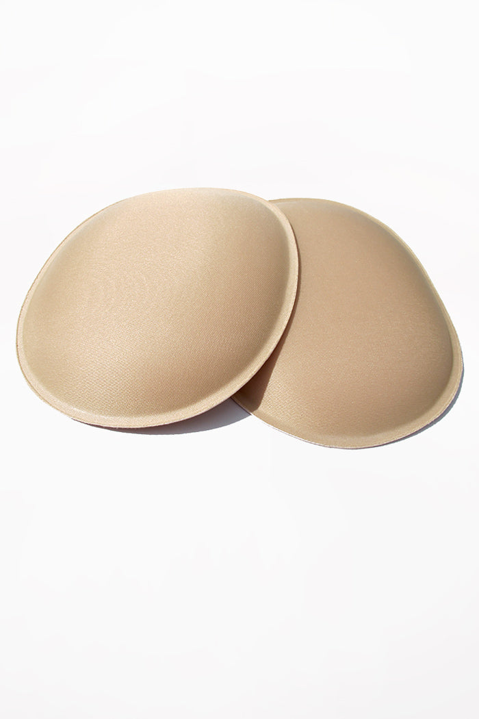 Beige oval foam pads for hips or butt.