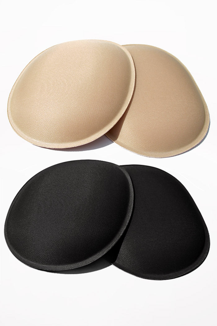 2 Pair of oval foam butt/hip pads pictured in both Beige and Black.